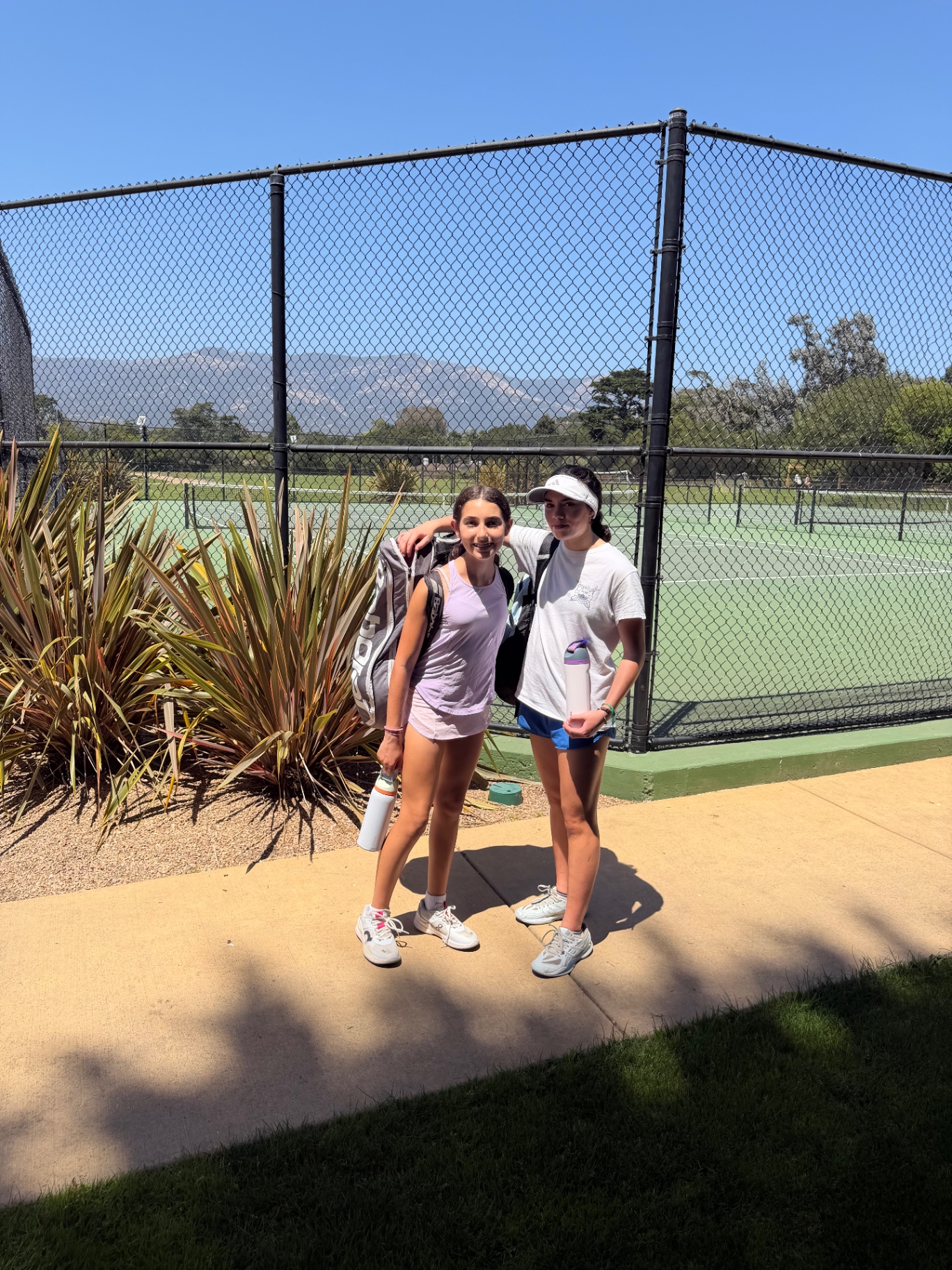 Off-court, on-court — laughing in the sun