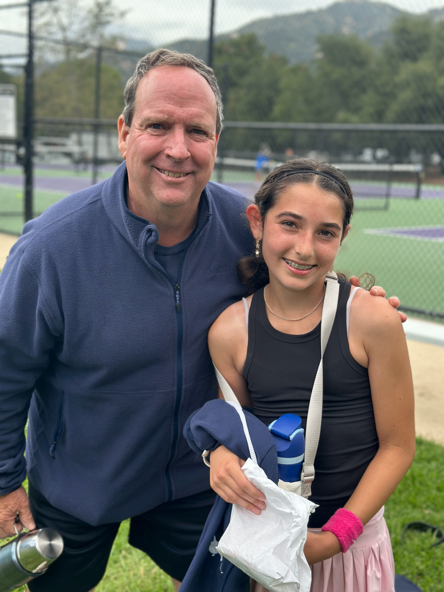Coach Jay Campbell with Gabriella at the tennis courts